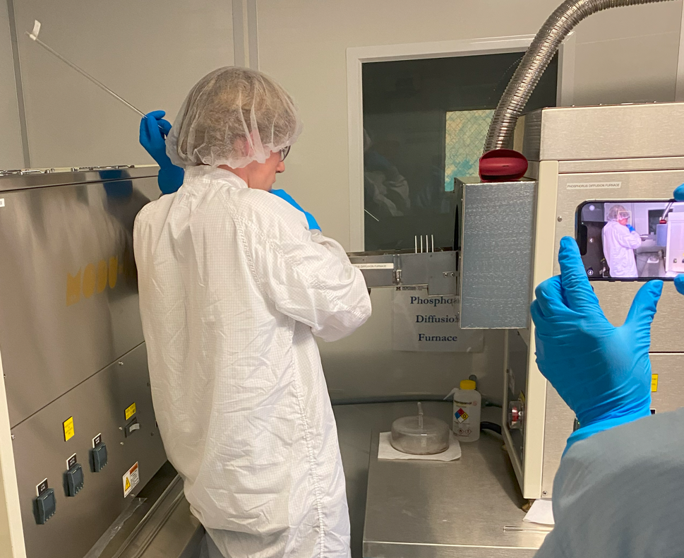 Figure A14: Lab #2 wafers being inserted into furnace with quarts rod. The wafers are inserted and removed slowly as to keep them from cooling off or heating up to quickly and prevent high stresses from thermal expansion.