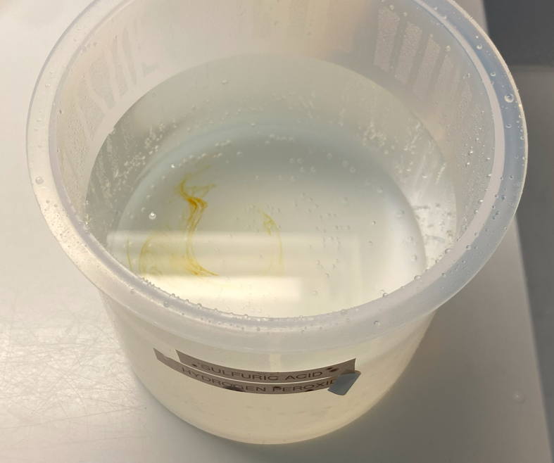 Figure A11: Lab #2 removed organics seen as yellow streaks in the solution.